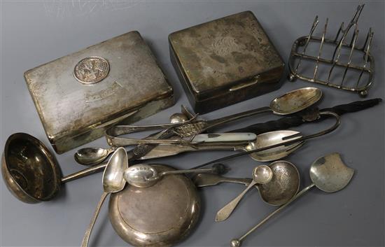 Minor silver cutlery including a William IV caddy spoon, a silver toast rack, two cigarette boxes and a tobacco box.